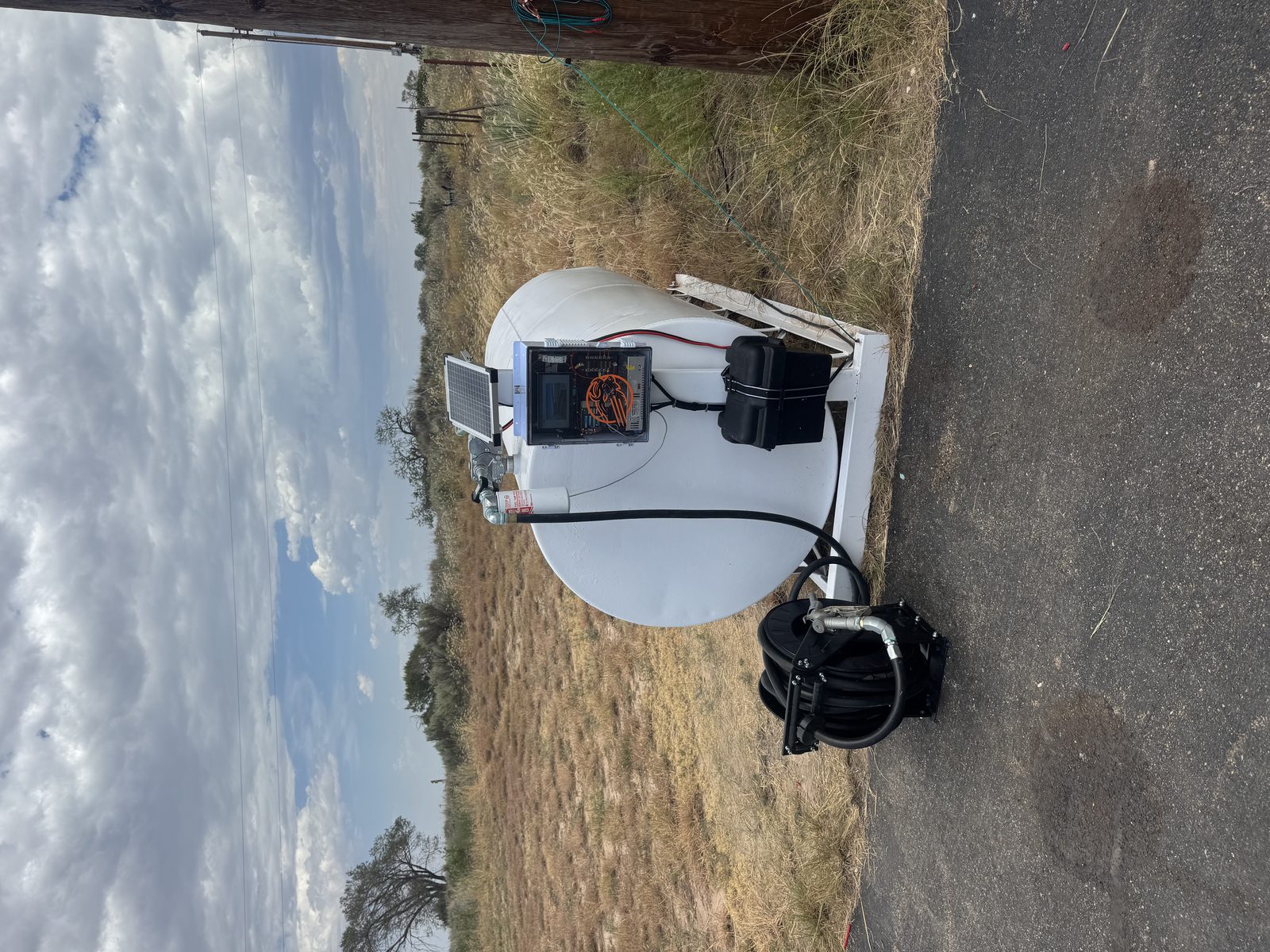 Close view of Buff Box control enclosure with solar panel on the Clarendon 100LL tank