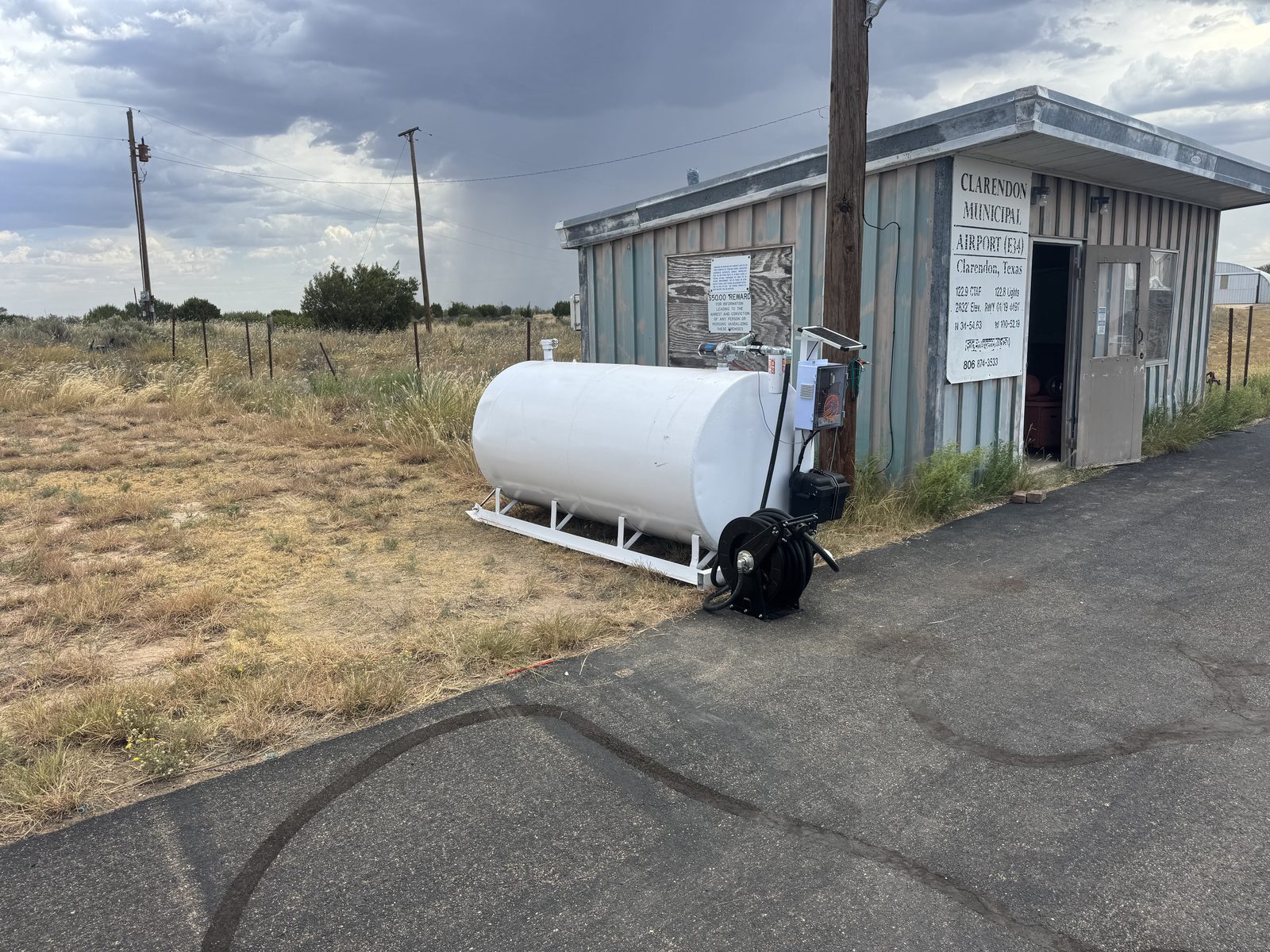 Buff Box on a white 100LL tank beside the Clarendon Municipal Airport E34 building